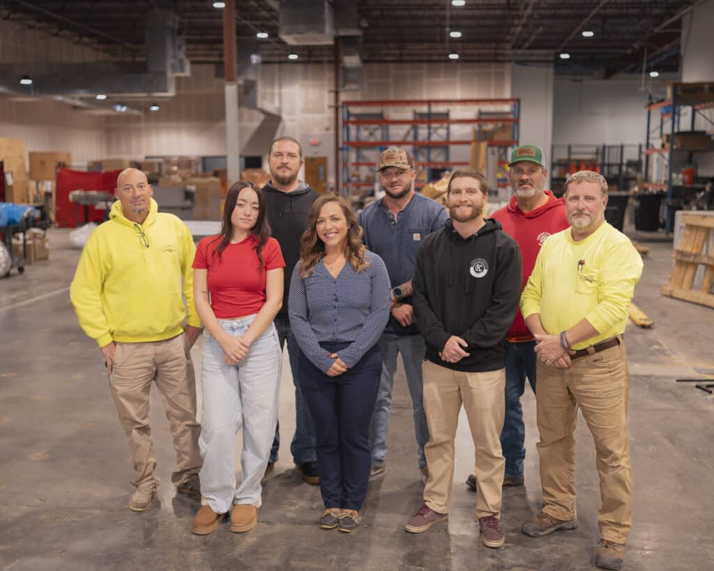 A group of mechanical contracting professionals in a fabrication shop. A group of mechanical contracting professionals in a fabrication shop.