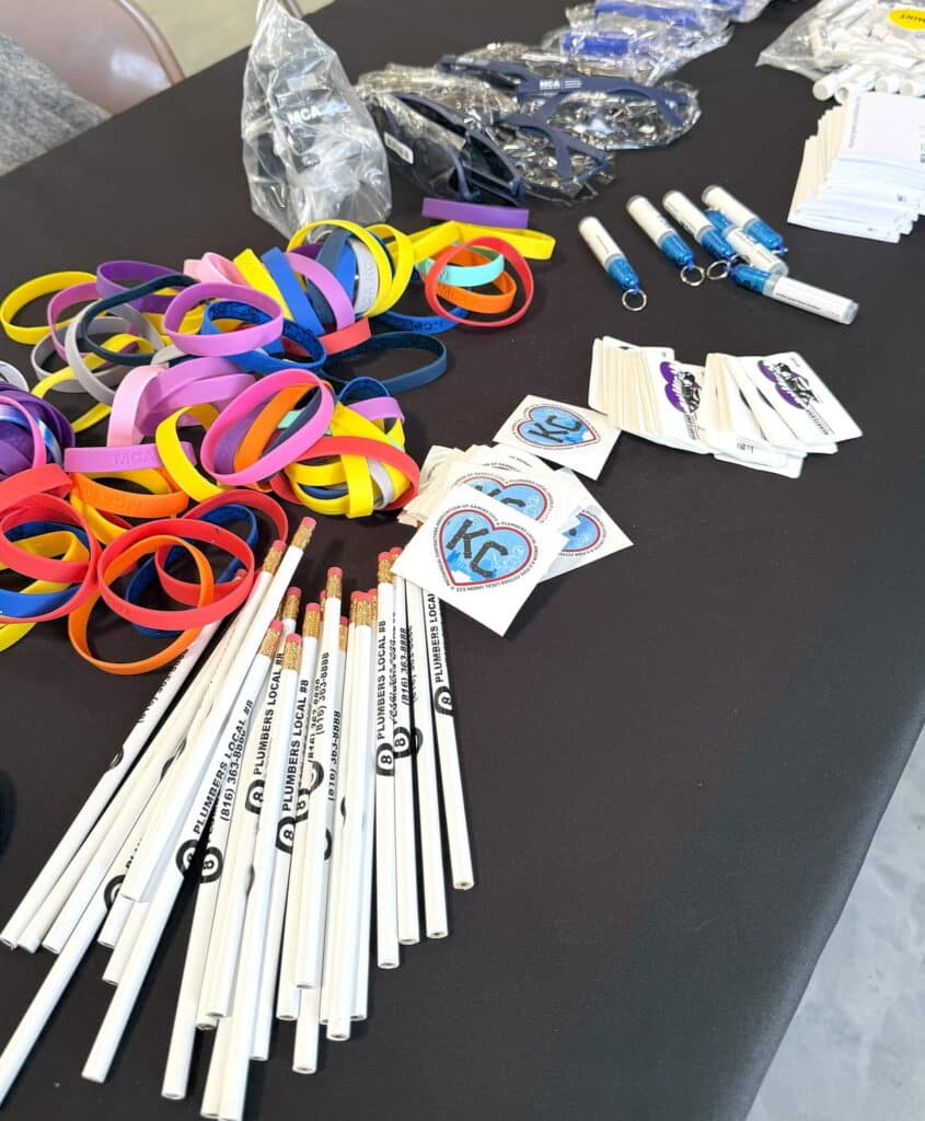 MCAKC-career-fair-table-with-student-giveaways-at-a-high-school-career-fair-in-Kansas-City